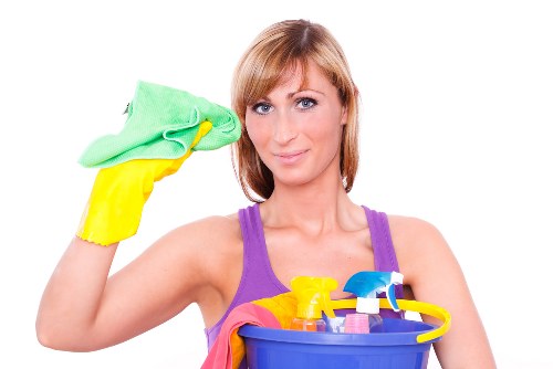 Cleaning technician preparing carpet cleaning equipment for a booked service