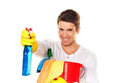 Local Bermondsey window cleaner working on a mixed-use property